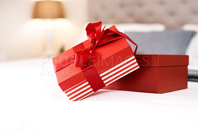 Buy stock photo Present, love gift and bedroom with no people with celebration box for valentines day. Red gifts, presents and bed in a house with surprise, celebrating and birthday package with ribbon and zoom