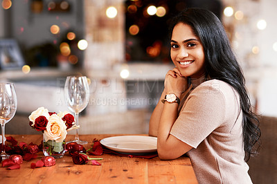 Buy stock photo Indian woman, restaurant and portrait of a young person ready for a romantic date. Bokeh lights, fine dining and female with a smile and happiness for anniversary or valentines day  feeling relax