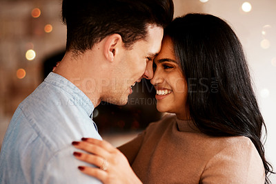 Buy stock photo Love, intimacy and happy couple hugging on a date for valentines day, romantic event or anniversary. Happiness, smile and interracial man and woman embracing after a dinner celebration together.