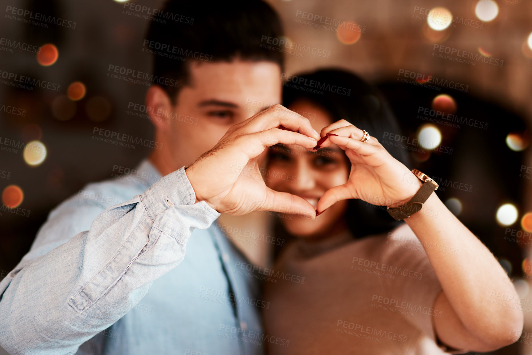 Buy stock photo Love, heart and couple in restaurant, happiness and bonding on Valentines day, affection and loving together. Romance, hand sign and man with woman, romantic and celebration for relationship and date