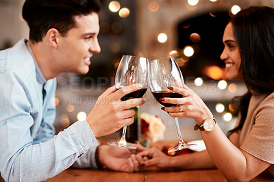 Buy stock photo Couple holding hands at table, love and cheers with wine on valentines day date at home with smile and bokeh. Date night, man and woman in living room, valentine celebration and happy relationship.