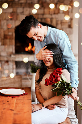 Buy stock photo Surprise, love and man with flowers for his wife while on a romantic date for valentines day. Happy, smile and husband with a bouquet of red roses for his woman while at dinner for their anniversary.