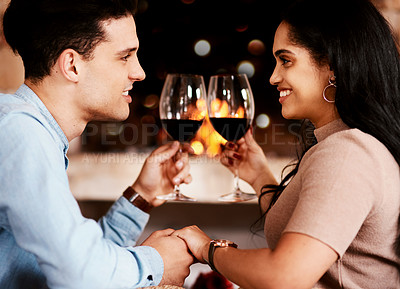 Buy stock photo Date night, wine and fire with couple holding hands at restaurant with love and care. Anniversary celebration, valentines day and happiness of young people together with alcohol in glass with cheers
