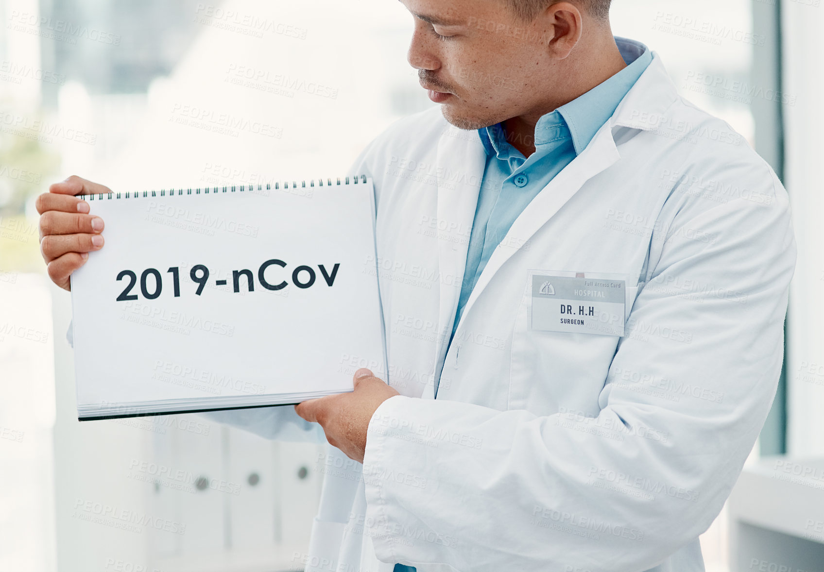 Buy stock photo Man, doctor and hands with sign for covid, pandemic or start of year or virus at hospital. Closeup, medical professional or healthcare employee with poster, page or paper for post or pre coronavirus