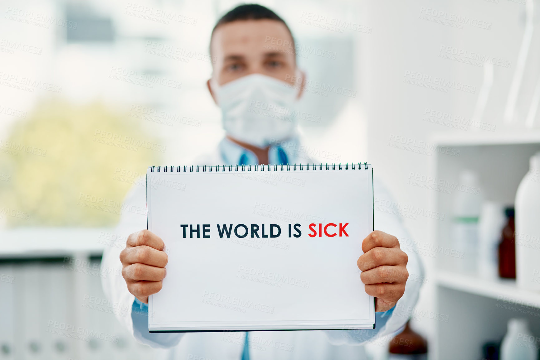 Buy stock photo Shot of a scientist holding a sign with “The world is sick” on it in a laboratory