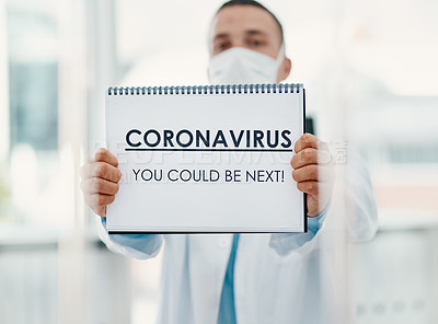 Buy stock photo Man, doctor and mask with poster for coronavirus, pandemic or viral outbreak at hospital. Male person, medical worker or healthcare employee with sign, alert or message for covid safety or precaution