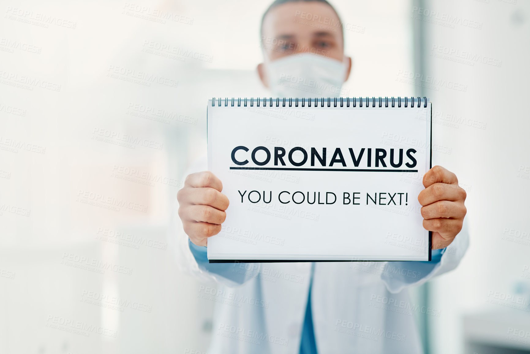 Buy stock photo Man, portrait or doctor with poster for coronavirus, pandemic or viral outbreak at hospital. Male person, medical worker or healthcare employee with sign, alert or message for covid safety or warning