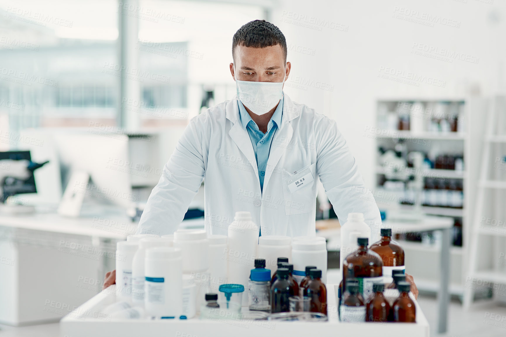 Buy stock photo Healthcare, man and analysis of medicine, chemist and inventory for safety, label and expiration. Pharmacist, mask and medical professional with antibiotics, science and pills for treatment in shop