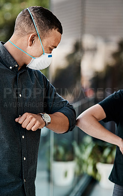 Buy stock photo Shot of a young man bumping elbows with an unrecognisable woman outdoors