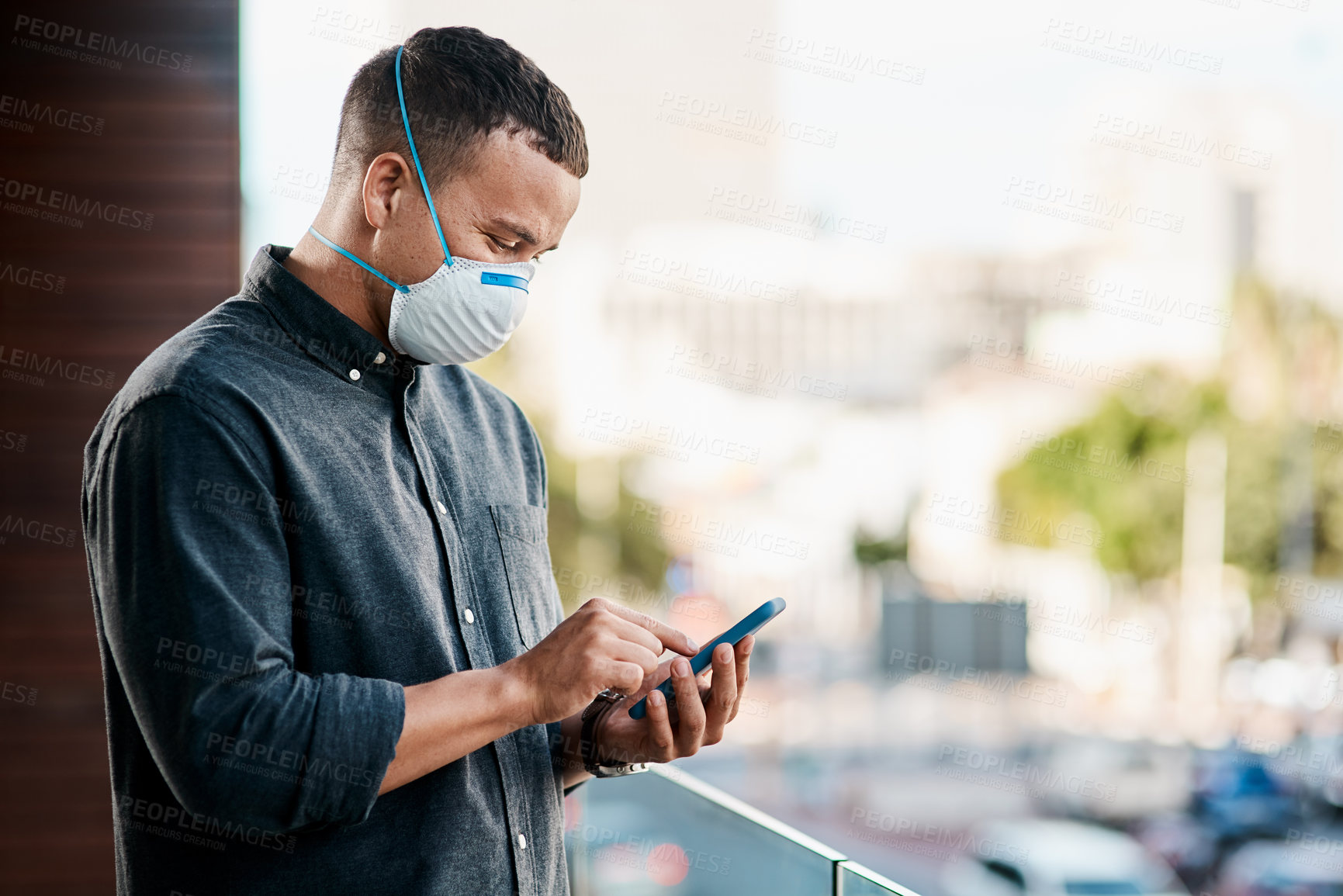 Buy stock photo Outdoor, pandemic or businessman with mobile, mask and research for covid awareness or flu season. Social media, virus or employee on balcony with network app, phone notification or healthcare news