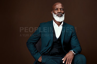 Buy stock photo Business, fashion and serious portrait of black man with confidence, pride or professional in studio mockup. Director, ceo or mature African businessman in corporate style on brown background space