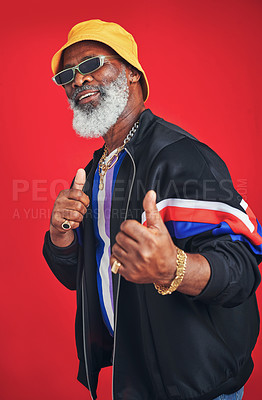 Buy stock photo Mature man, fashion and happiness as retro for trendy outfit, casual and pride on red background. Male person, African and accessory for cool, clothes and style with vintage or sunglasses as designer