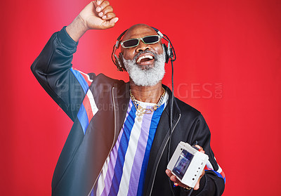 Buy stock photo Shot of a mature man listening to music through headphones