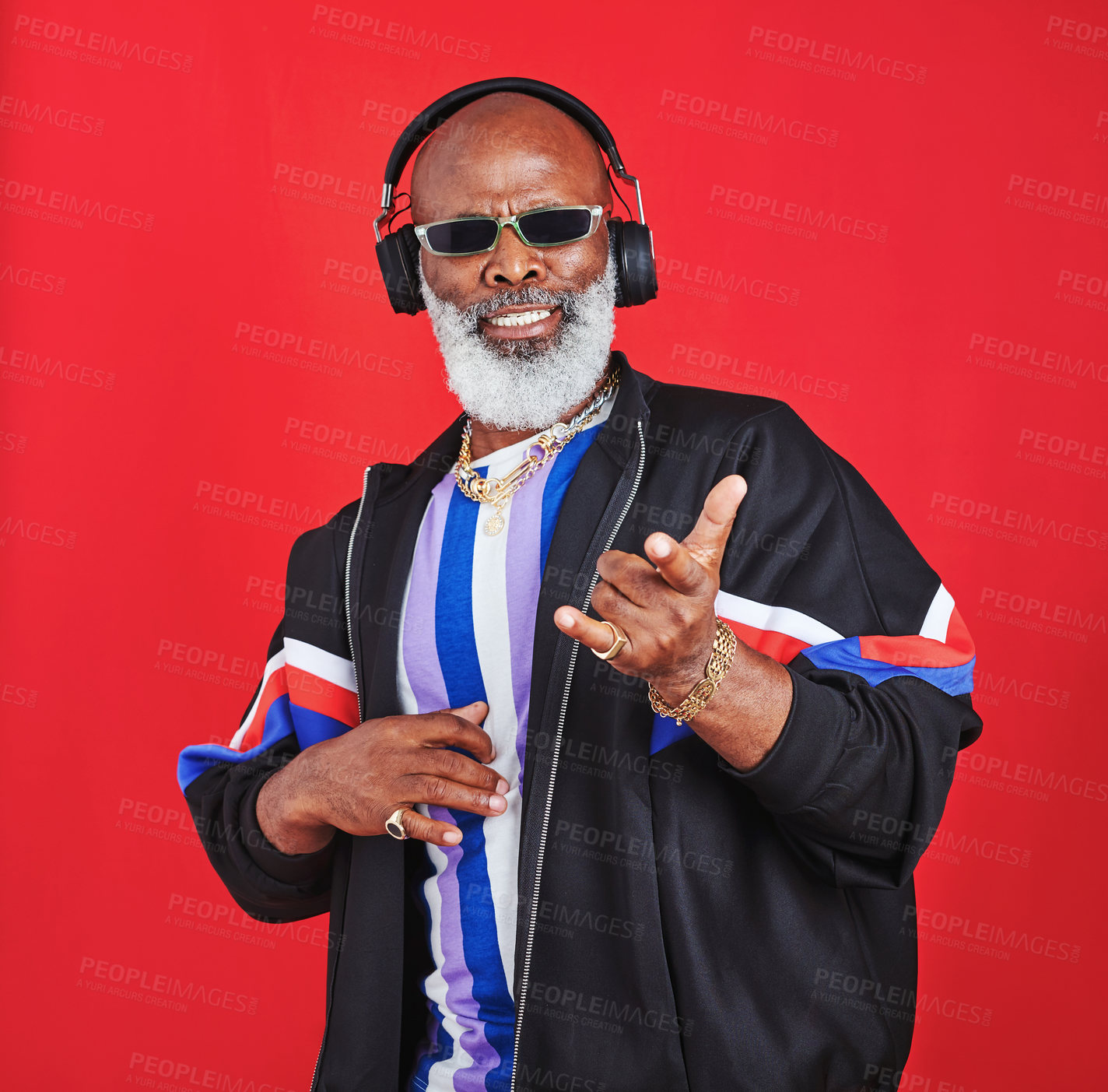 Buy stock photo Shot of a mature man listening to music through headphones