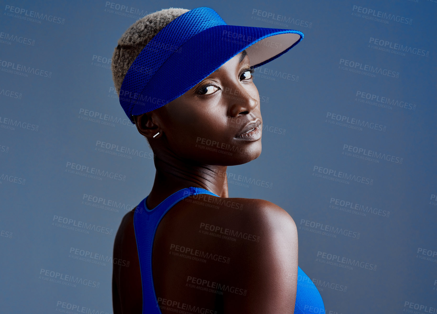 Buy stock photo Visor, fashion and portrait of black woman in studio for fitness training, workout or match with athlete. Pride, style and African sport player with confidence for game in hat by blue background.