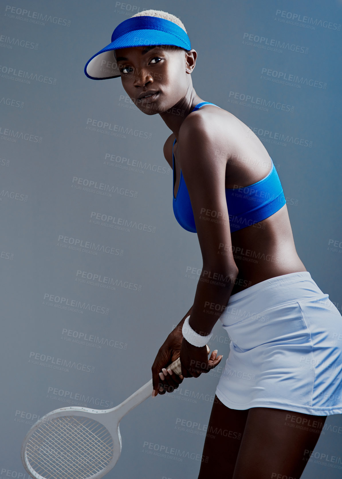 Buy stock photo Black woman, tennis and player with racket for match, sports or game on a studio background. Young African, female person or athletic player with bat and fashion for friendly competition or challenge