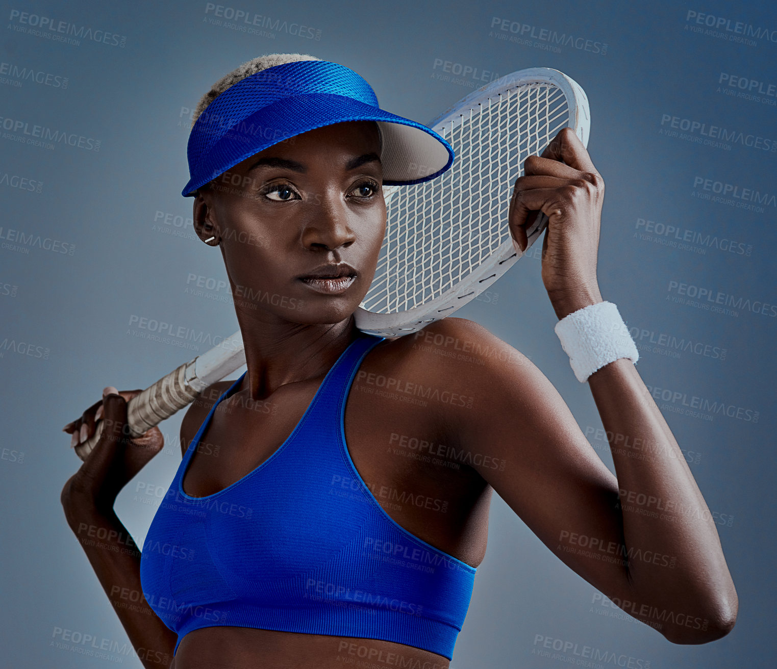 Buy stock photo Fitness, thinking and black woman with tennis racket in studio for competition, practice and exercise. African person, visor and serious with equipment for sports, game or training by blue background