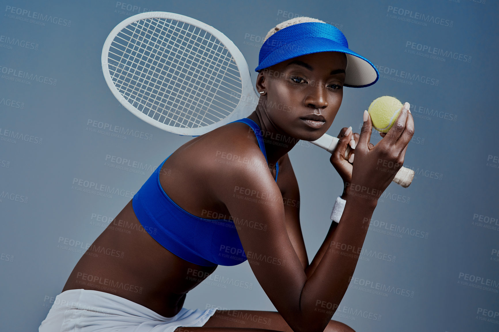 Buy stock photo Black woman, thinking and tennis player in studio, sports planning and racket on blue background. Female person, athlete and equipment for exercise activity, reflection and workout for competition