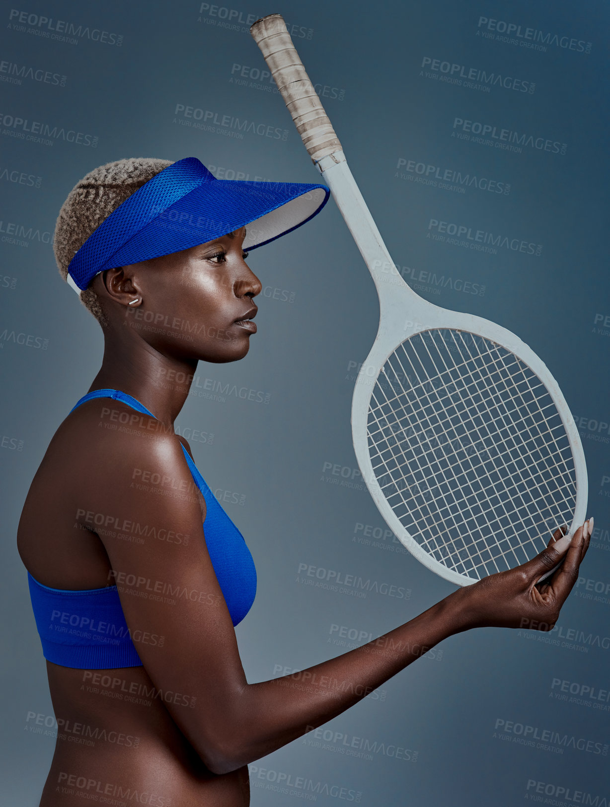 Buy stock photo Black woman, thinking and racket for tennis in studio, sports plan and profile on blue background. Female person, athlete and balance equipment for exercise, reflection and workout for competition