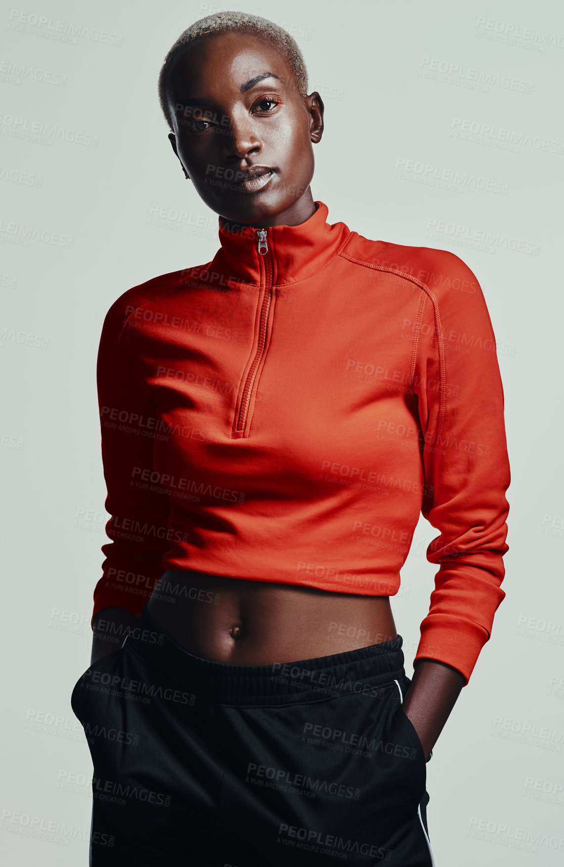 Buy stock photo Studio shot of an attractive young woman in sportswear against a grey background