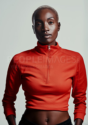 Buy stock photo Studio shot of an attractive young woman in sportswear against a grey background