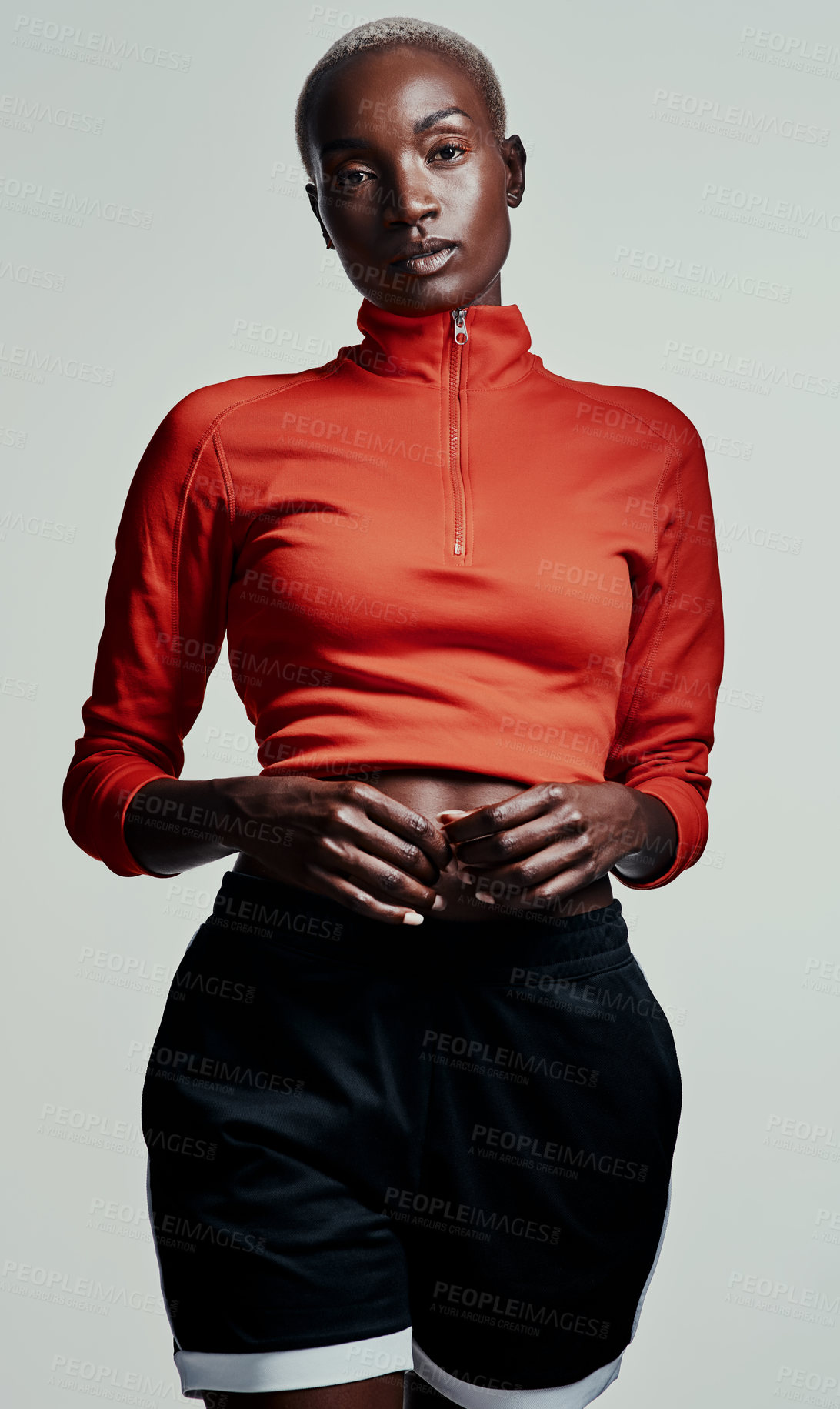 Buy stock photo Studio shot of an attractive young woman in sportswear against a grey background