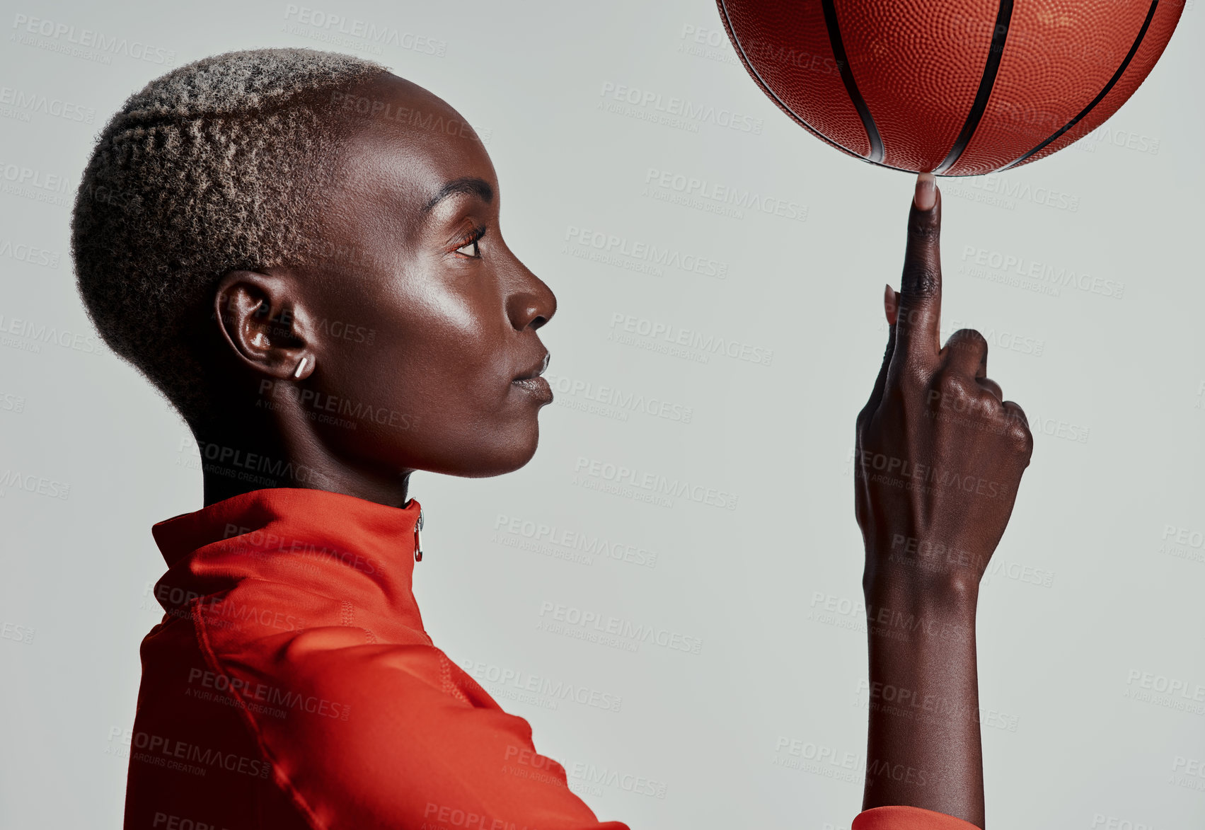 Buy stock photo Studio, black woman and sport with basketball for spinning, balance or trick for competition game. Fitness, female person or professional player with practice for skills, training or white background