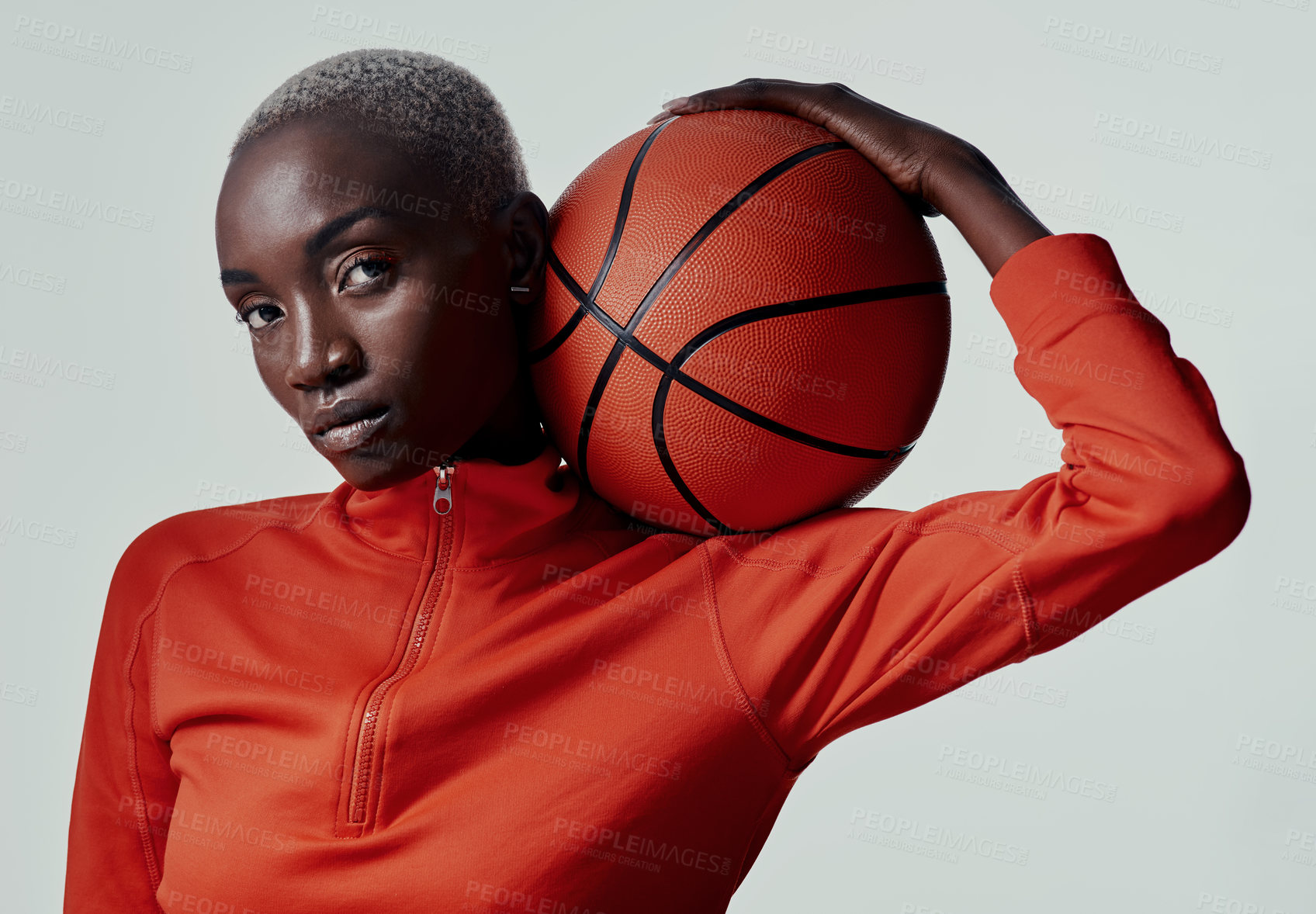 Buy stock photo Serious, black woman and portrait with basketball in studio, balance and skills for game competition. Fitness, female person and player with ideas for practice, training and sport by white background