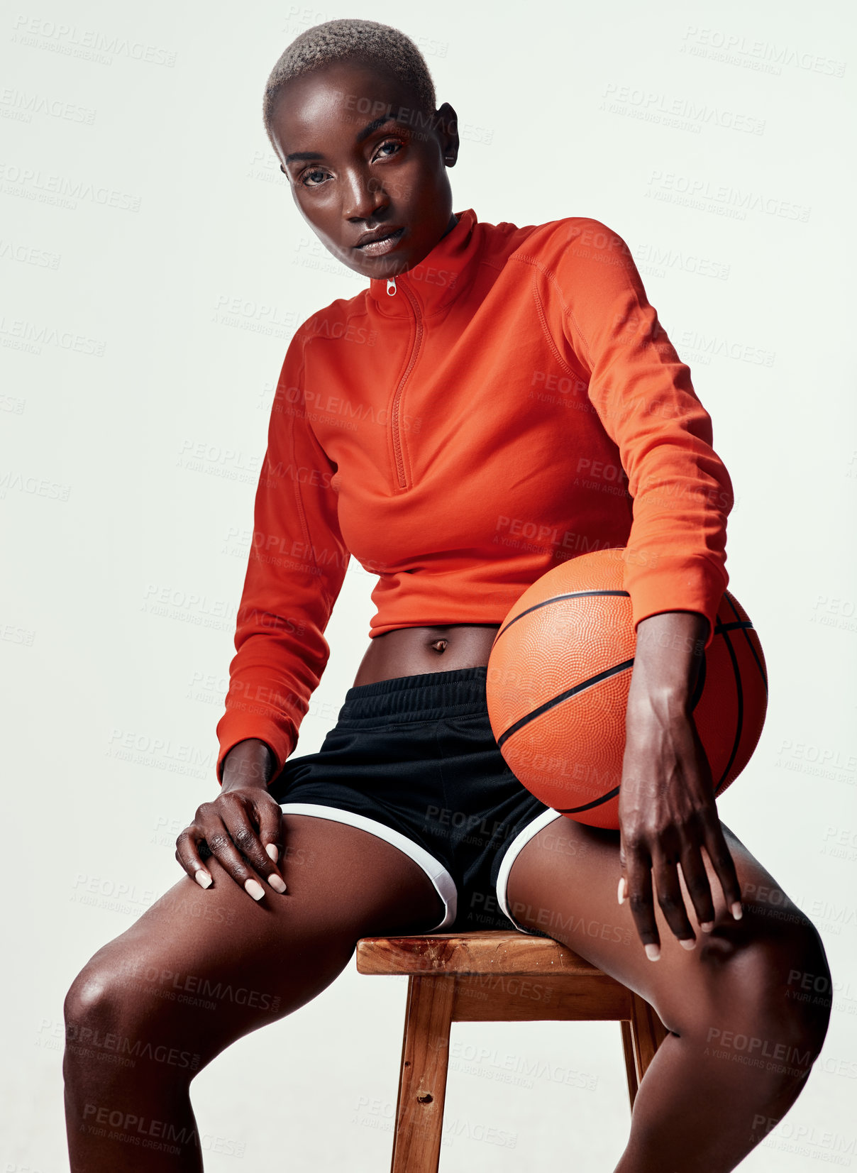 Buy stock photo African woman, basketball player and studio portrait on chair, confidence and fitness by white background. Person, athlete and ready for sports, training and competition on wood stool in Nigeria