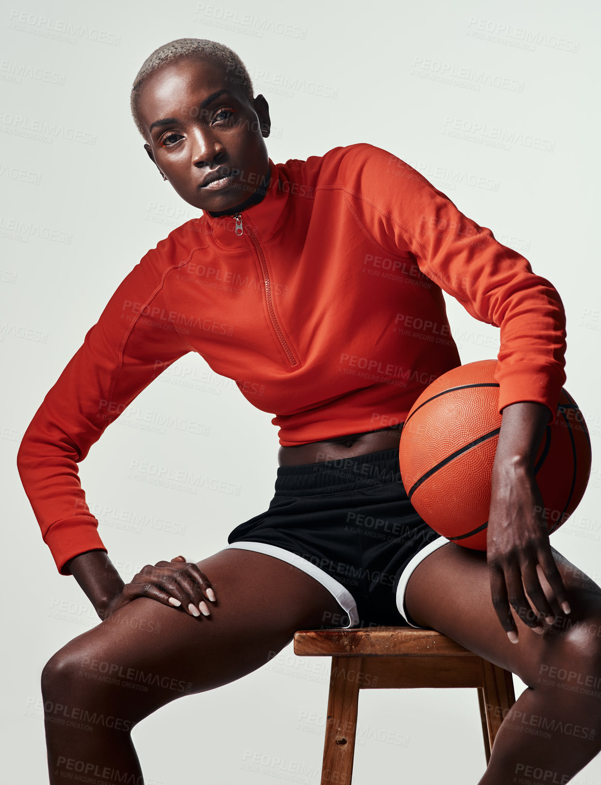 Buy stock photo African woman, basketball and studio portrait on chair, confidence and fitness by white background. Person, athlete and ready for games, sports and training for competition on wood stool in Kenya