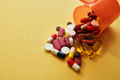 Buy stock photo Container, medicine and pills with health in studio of healthcare wellness, medical nutrition and prescription. Drugs, choice and tablets stock for recovery, treatment and cure on yellow background