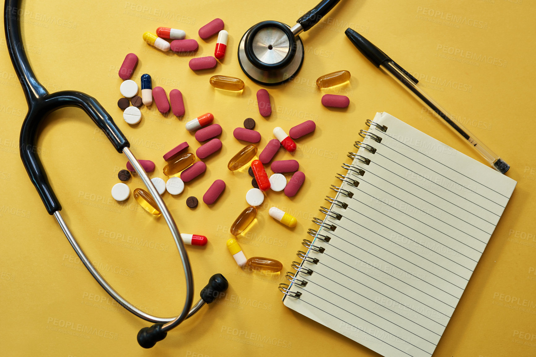 Buy stock photo Stethoscope, notebook and notes pills in studio of medical diagnosis, medicine prescription and record. Healthcare, equipment and cardiology with report, treatment plan and drugs on yellow background