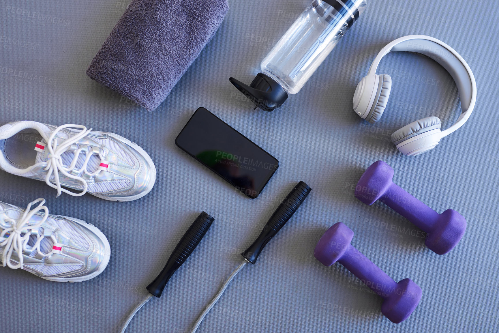 Buy stock photo Studio shot of a variety of workout equipment against a grey background