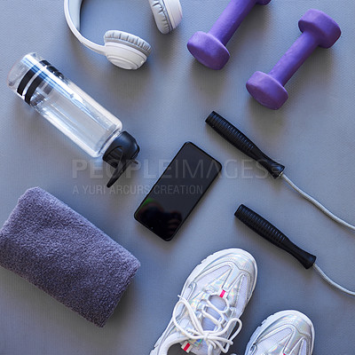 Buy stock photo Studio shot of a variety of workout equipment against a grey background