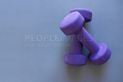 Buy stock photo Studio shot of two dumbbells against a grey background