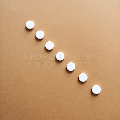 Buy stock photo Row, medicine and drugs for health in studio with healthcare wellness, medical painkillers and prescription. Pills, tablets and addiction for treatment, pain remedy and recovery on background