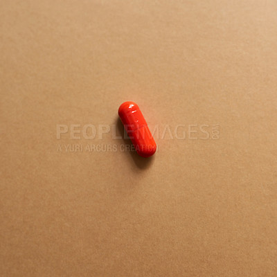 Buy stock photo Red, medicine and drugs for health in studio with healthcare wellness, medical painkillers and prescription. Pills, tablets and addiction with treatment, pain remedy and recovery on brown background