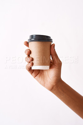 Buy stock photo Studio shot of an unrecognizable woman holding a disposable coffee cup against a white background