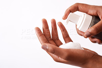 Buy stock photo Studio shot of an unrecognizable woman putting foam on her hands