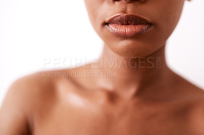 Buy stock photo Closeup shot of a beautiful young woman posing with glossy lips against a white background