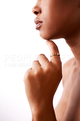 Buy stock photo Closeup shot of a beautiful young woman posing with glossy lips against a white background