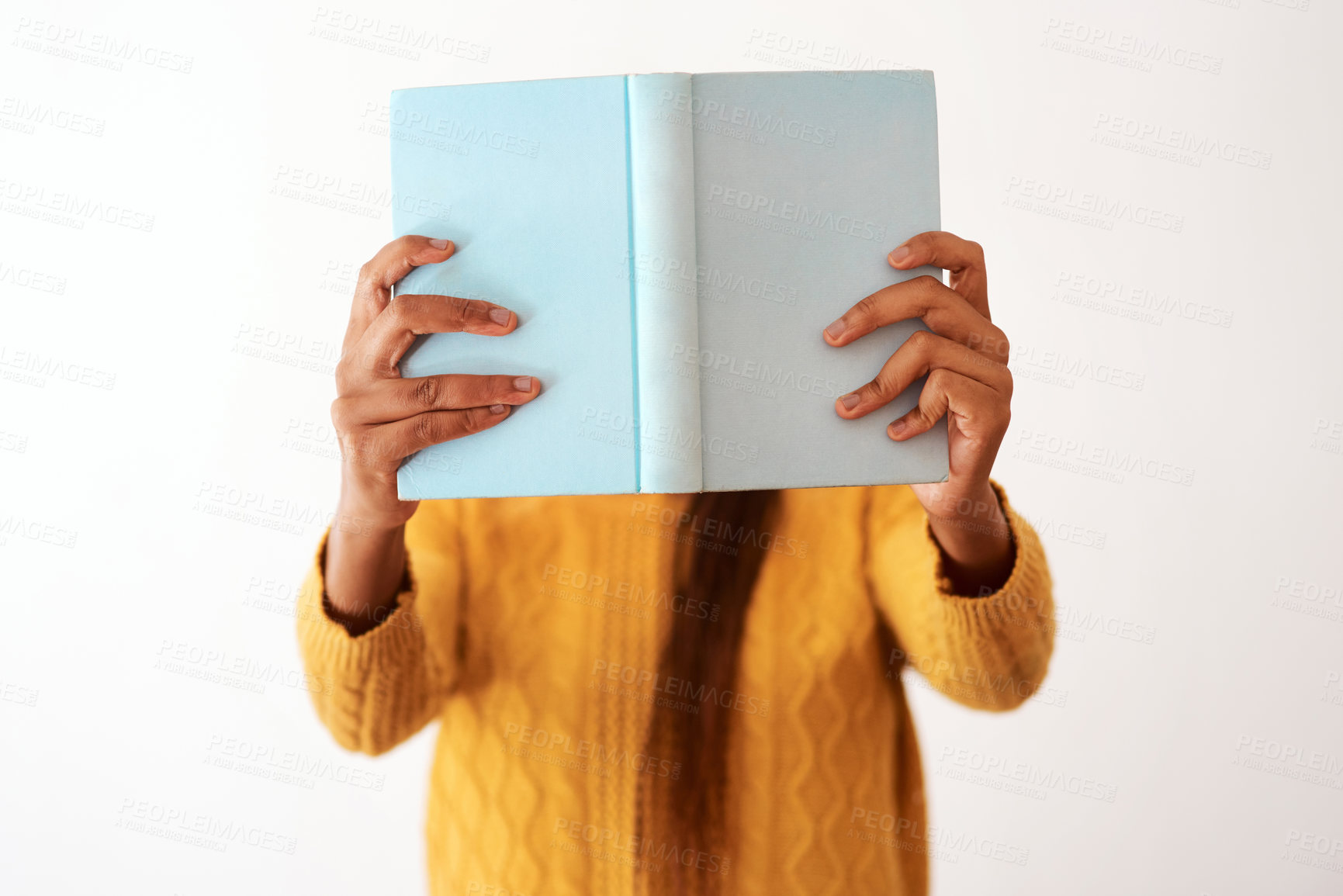 Buy stock photo Woman, white background and book by face for reading, storytelling and novel for literature. Female person, isolated and secret story for entertainment with learning, information and knowledge