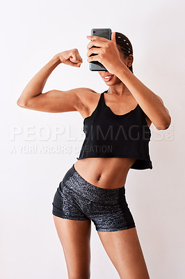 Buy stock photo Woman, white background and smile for selfie with biceps for social media, post or profile picture. Female person, fitness and happy or satisfied for muscles flex with confidence, pride and exercise