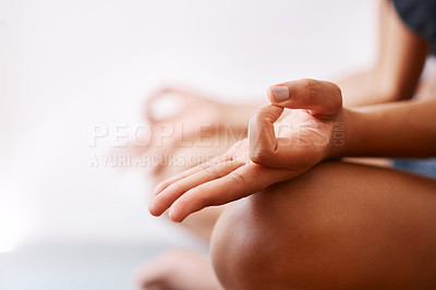 Buy stock photo Cropped shot of an unrecognizable woman practising yoga against a white background