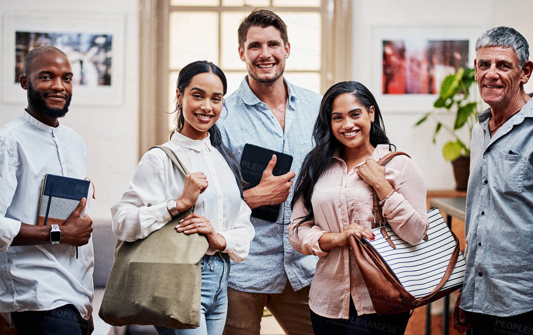 Buy stock photo Portrait of a group of confident businesspeople working in a modern office