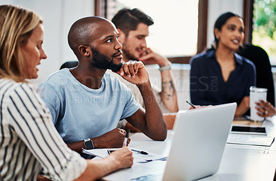 Buy stock photo Cropped shot of a group of business colleagues having a strategy meeting in the boardroom