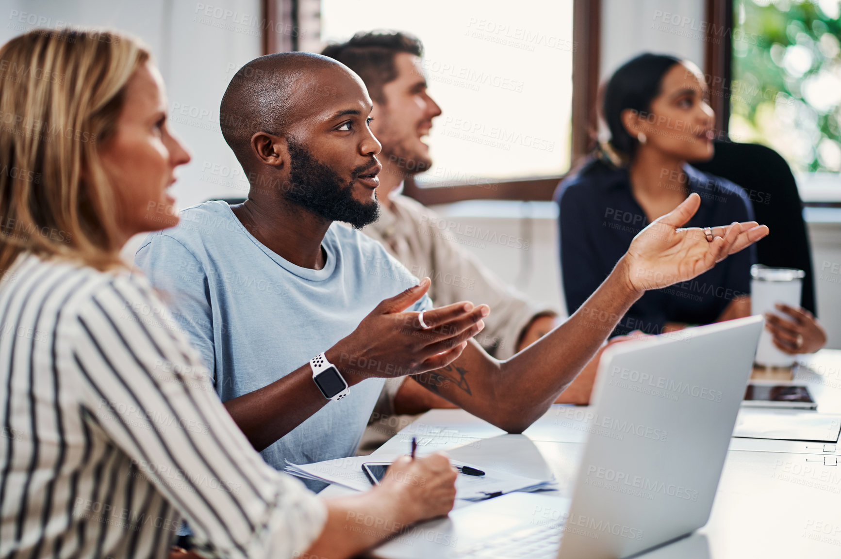 Buy stock photo Cropped shot of a group of business colleagues having a strategy meeting in the boardroom