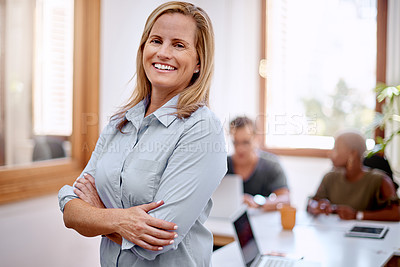 Buy stock photo Portrait of a mature businesswoman standing in an office