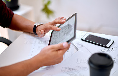 Buy stock photo Closeup shot of an unrecognisable architect using a digital tablet in an office