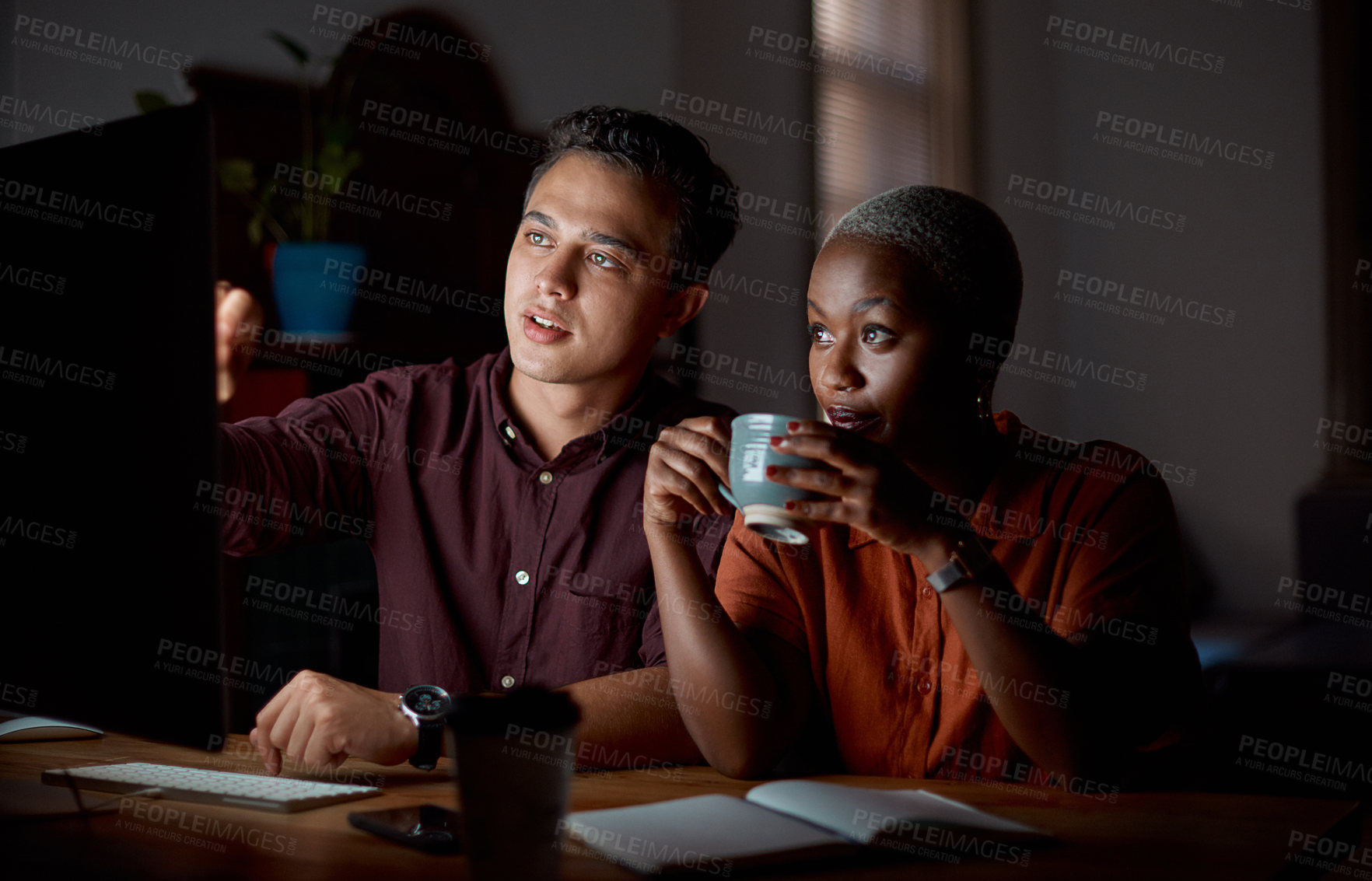 Buy stock photo Night, team and business with tech for planning, discussion and schedule in office. Man, woman or computer in dark for brainstorming, overtime and feedback from international clients in design agency